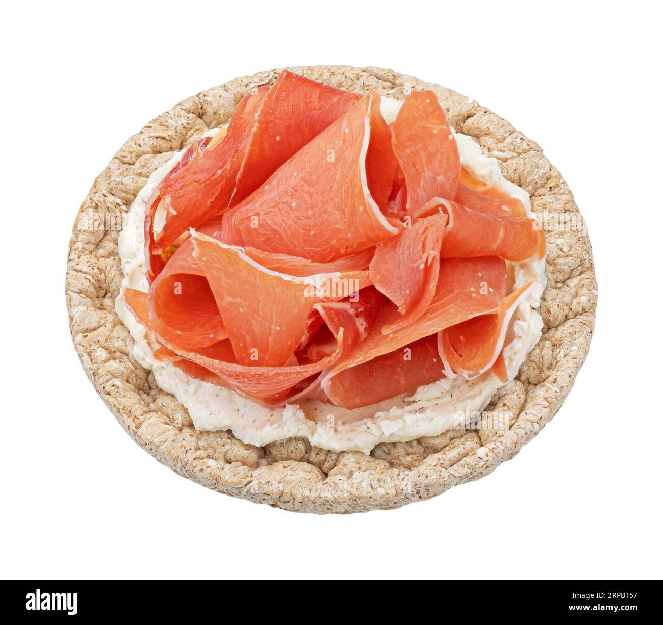 Puffed rice cake with cream cheese and smoked ham isolated on white