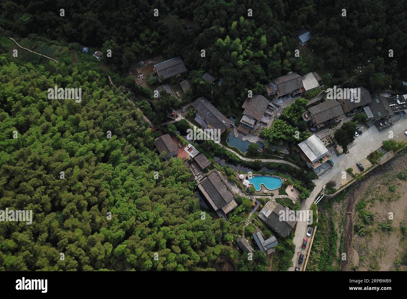 (190616) -- TONGLU, June 16, 2019 (Xinhua) -- Aerial photo taken on June 16, 2019 shows part of a rural tourism industrial cluster in Qinglongwu of Tonglu County, east China s Zhejiang Province. In recent years, Tonglu County has been rolling out measures to develope rural tourism industry. Qinglongwu was transformed into a base of rural guesthouses for tourists to experience the countryside life. (Xinhua/Huang Zongzhi) CHINA-ZHEJIANG-TONGLU-RURAL TOURISM (CN) PUBLICATIONxNOTxINxCHN Stock Photo