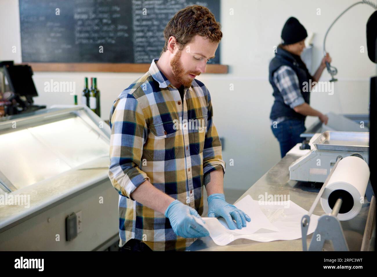 People working in fish store Stock Photo Alamy