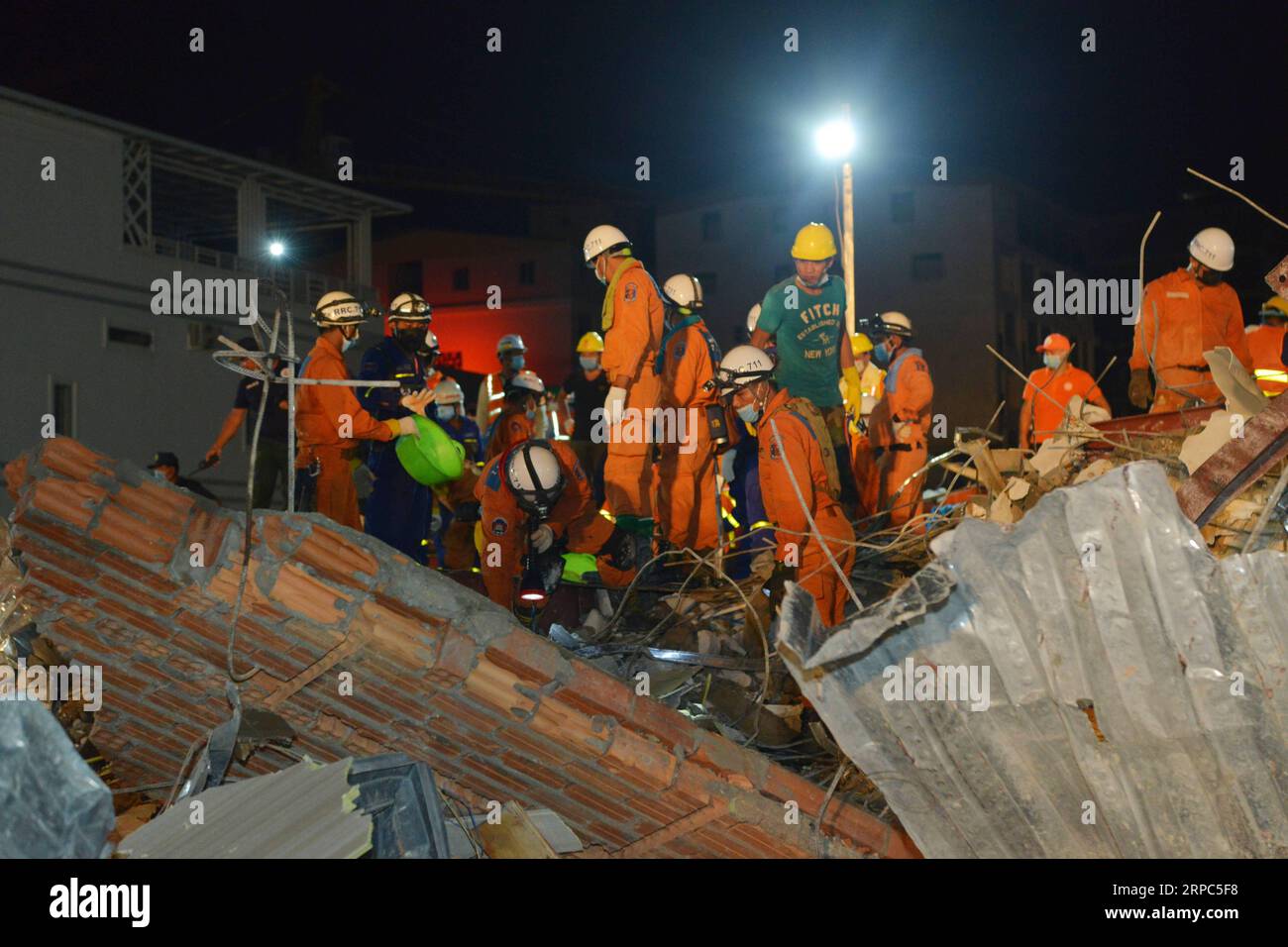 (190624) -- PHNOM PENH, June 24, 2019 -- Rescuers search for trapped people in a collapsed building in Sihanoukville city in Preah Sihanouk province, Cambodia on June 24, 2019. The death toll in the collapse of a seven-story under-construction building in southwestern Cambodia s Preah Sihanouk Province early Saturday, has risen to 25, according to the latest report released by the rescue team on Monday. ) CAMBODIA-ACCIDENT-BUILDING COLLAPSE LixLay PUBLICATIONxNOTxINxCHN Stock Photo