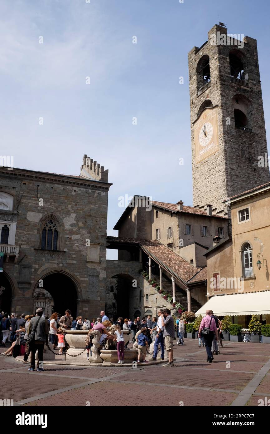 Piazza Vecchia, Contarini fountain and Bell Tower, Bergamo, Italy. Stock Photo
