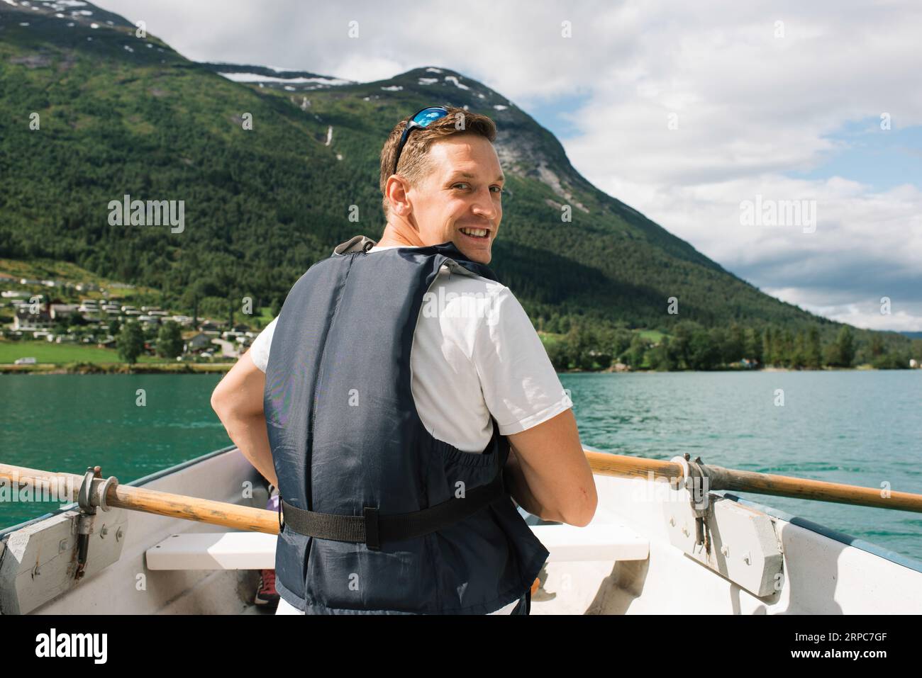 Man in boat rowing beautiful hi-res stock photography and images - Alamy