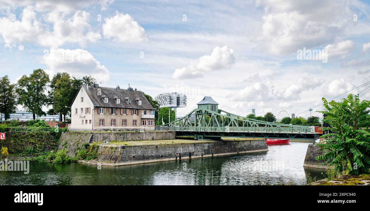 the renovated historic swing bridge at the entrance to cologne deutz harbor Stock Photo