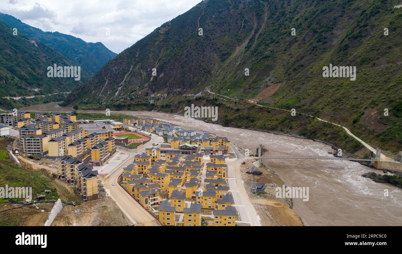 (190628) -- KUNMING, June 28, 2019 -- Aerial photo taken on June 24, 2019 shows a resettlement site for people of Lisu ethnic group in Daxingdi Town, Lisu Autonomous Prefecture of Nujiang, southwest China s Yunnan Province. Lisu people have been relocated to a new community from unlivable mountain areas thanks to the poverty alleviation policy by local government. Zhiguo minorities are special members of China s 56 ethnic groups. The term Zhiguo refers to minority groups who, before modernization, had lived in relative isolation and skipped the transition period associated with feudal monarchy Stock Photo