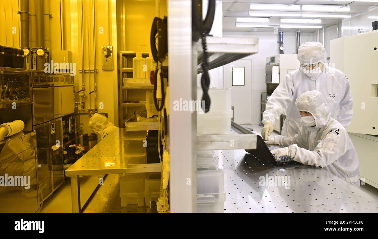 (190701) -- DALIAN, July 1, 2019 -- Engineers work at Xinguan Technology, a semiconductor high-tech enterprise in Dalian, northeast China s Liaoning Province, April 1, 2019. The 2019 Summer Davos Forum is held from July 1-3 in northeast China s coastal city of Dalian. Established by the World Economic Forum in 2007, the forum is held annually in China, alternating between the two port cities of Dalian and Tianjin. Summer Davos helped Dalian reshape the landscape of regional economy and strengthen the port s trade with other markets. Dalian has become an international city and a showpiece of Ch Stock Photo