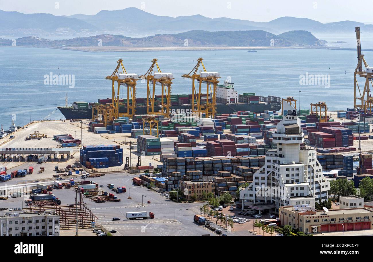 (190701) -- DALIAN, July 1, 2019 -- Photo taken on June 24, 2019 shows the Dayaowan container terminal in Dalian, northeast China s Liaoning Province. The 2019 Summer Davos Forum is held from July 1-3 in northeast China s coastal city of Dalian. Established by the World Economic Forum in 2007, the forum is held annually in China, alternating between the two port cities of Dalian and Tianjin. Summer Davos has been reshaping the landscape of Dalian s regional economy and strengthening the port s trade with other markets. Dalian has become an international city and a showpiece of China s reform a Stock Photo