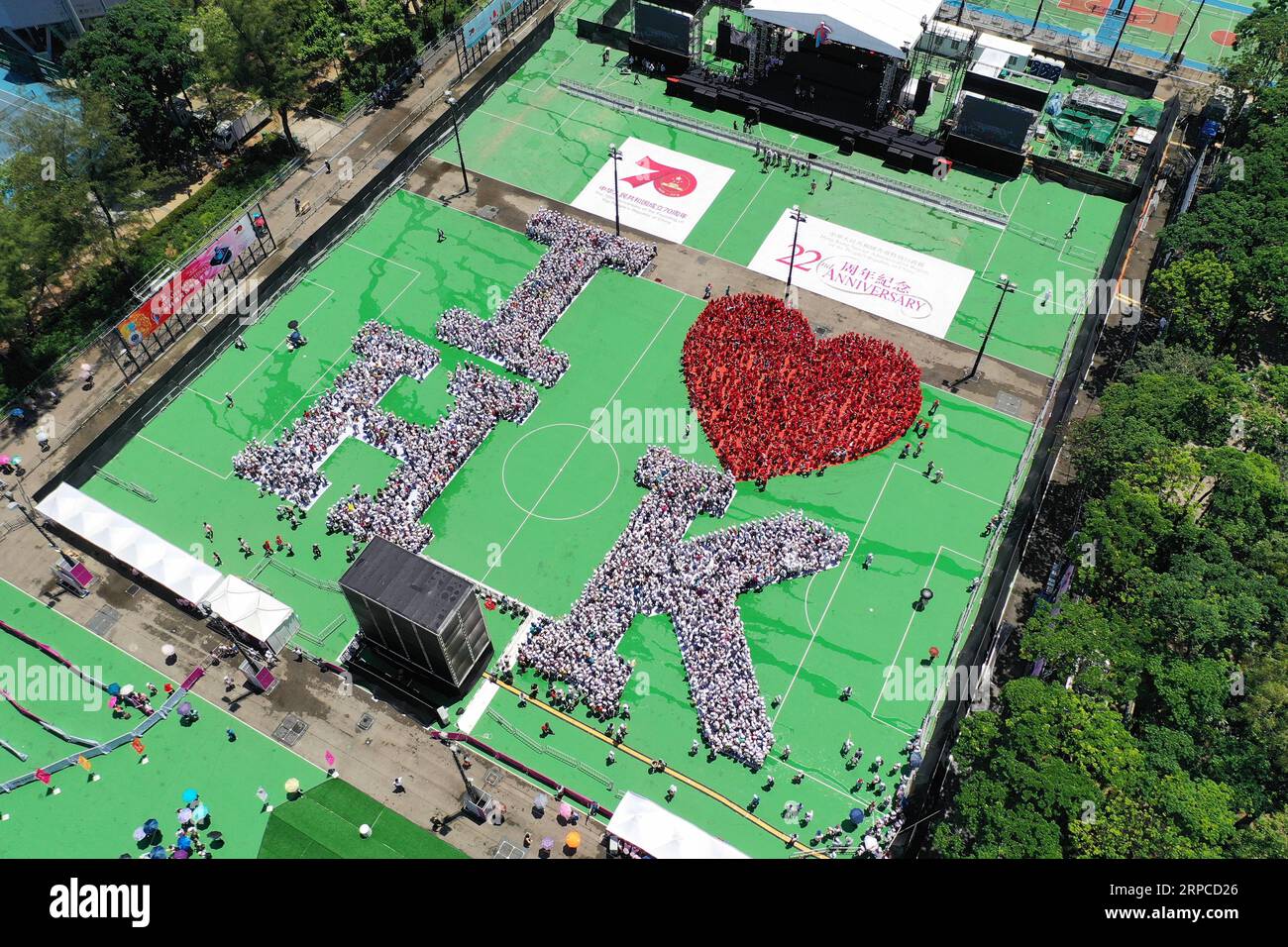 (190701) -- HONG KONG, July 1, 2019 (Xinhua) -- Aerial photo taken on July 1, 2019 shows a formation which spells out the words I LOVE HK to celebrate the 22nd birthday of the Hong Kong Special Administrative Region (HKSAR) in south China s Hong Kong. About 5,000 people gathered at Victoria Park in Hong Kong on Monday and stood in the formation spelling out words I LOVE HK to celebrate the 22nd birthday of the Hong Kong Special Administrative Region (HKSAR). (Xinhua/Lui Siu Wai) CHINA-HONG KONG-ANNIVERSARY DAY-CELEBRATION (CN) PUBLICATIONxNOTxINxCHN Stock Photo