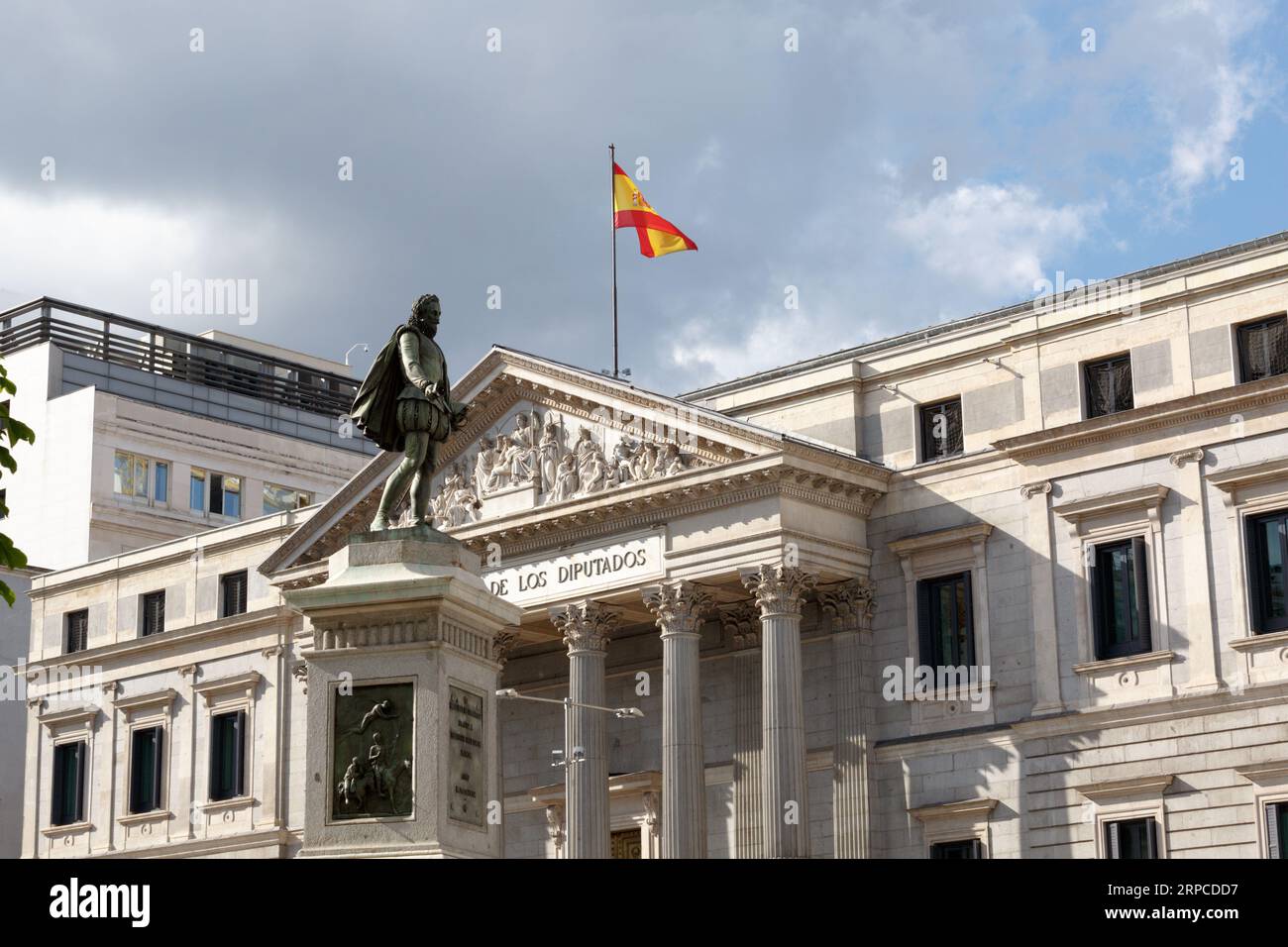 Madrid, Spain, April 29 2015: Assembly of Madrid. The sculpture Miguel De Cervantes De Saavedra in front of the Congreso De Los Diputados Stock Photo