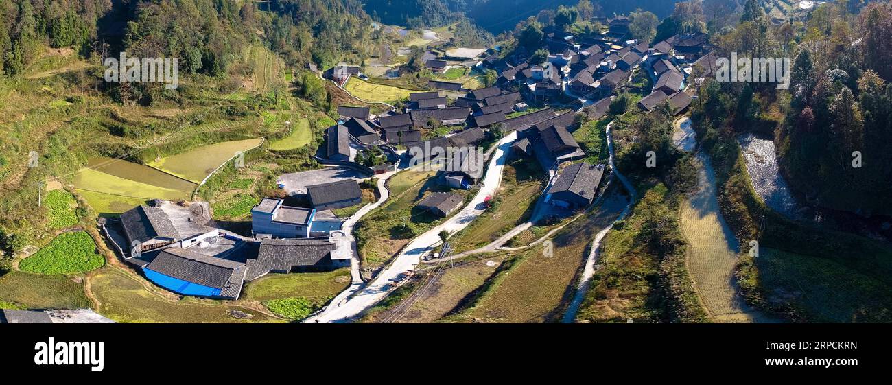 (190708) -- BEIJING, July 8, 2019 -- Aerial photo taken on Nov. 8, 2017 shows a residential dwelling cluster at Shibadong Village of Huayuan County, central China s Hunan Province. Located in central China, Hunan Province is well-known for its varied topography. It abuts the Dongting Lake to the north, and the east, south and west sides of the province are surrounded by mountains, with Wuling and Xuefeng Mountains to the west, Nanling Mountain to the south, Luoxiao and Mufu Mountains to the east. The Xiangjiang, Zijiang, Yuanjiang and Lishui Rivers converge on the Yangtze River at the Dongting Stock Photo