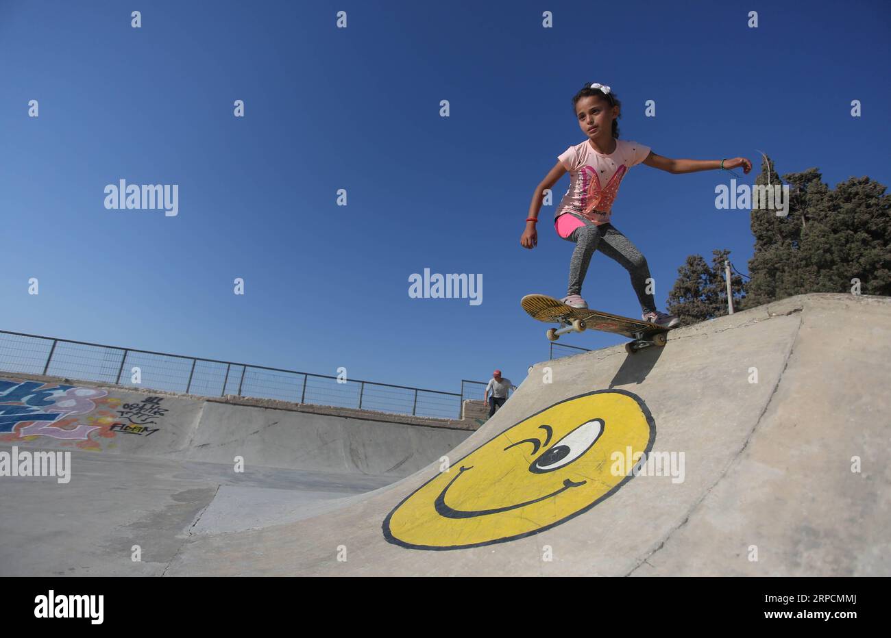 (190709) -- NABLUS, July 9, 2019 (Xinhua) -- A Palestinian girl skates at Skate Park Asira Al-Shamaliya in the West Bank city of Nablus, July 8, 2019. (Xinhua/Ayman Nobani) (SP)MIDEAST-NABLUS-SKATEBOARDING PUBLICATIONxNOTxINxCHN Stock Photo