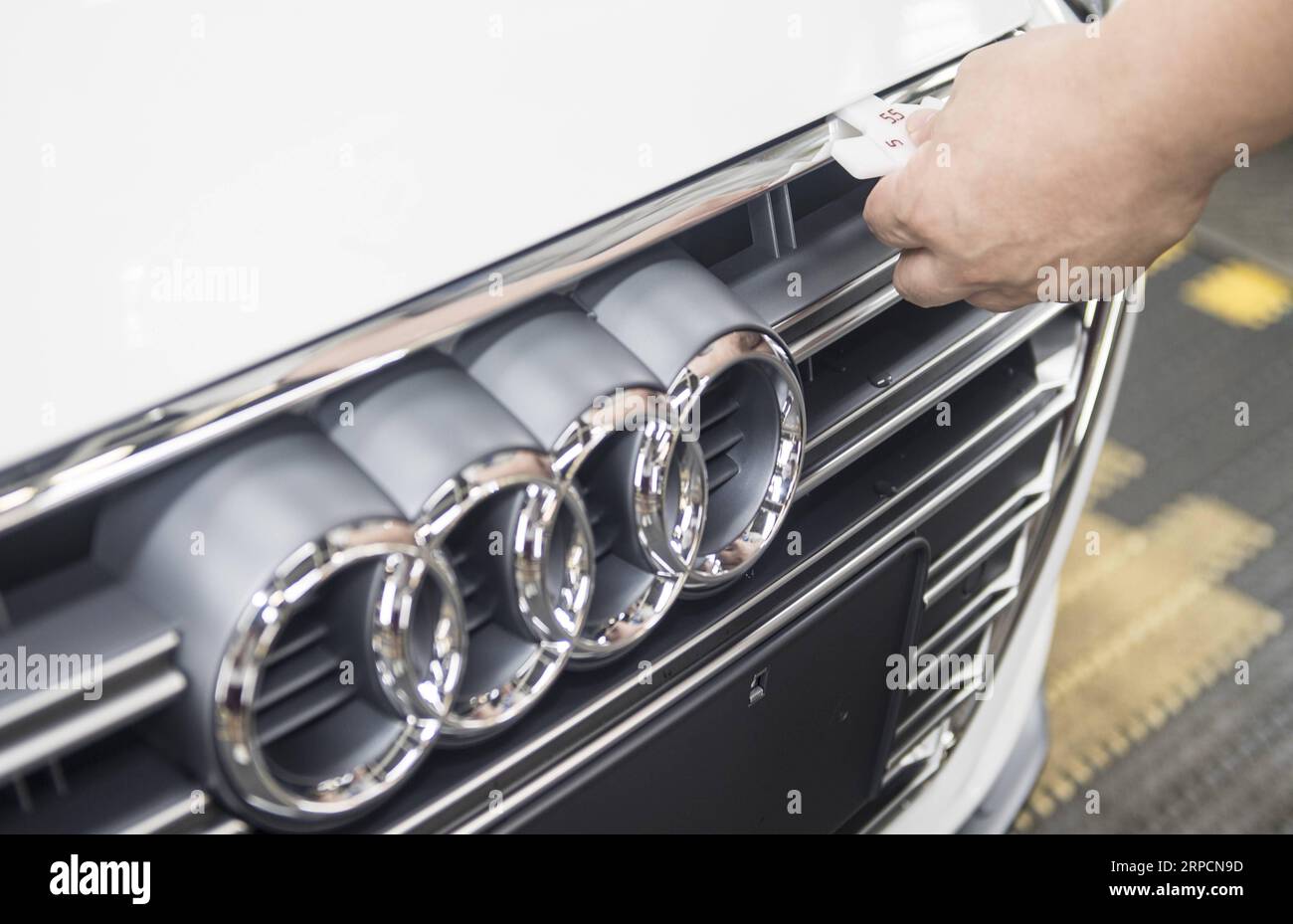 (190709) -- CHANGCHUN, July 9, 2019 -- A worker checks an Audi vehicle at FAW-Volkswagen factory in Changchun, northeast China s Jilin Province, July 9, 2019. The Sino-German auto joint venture FAW-Volkswagen said a record 311,871 Audi vehicles were sold in China in the first half of 2019, up 2.1 percent year-on-year. ) CHINA-JILIN-CHANGCHUN-AUDI-SALES RECORD XuxChang PUBLICATIONxNOTxINxCHN Stock Photo