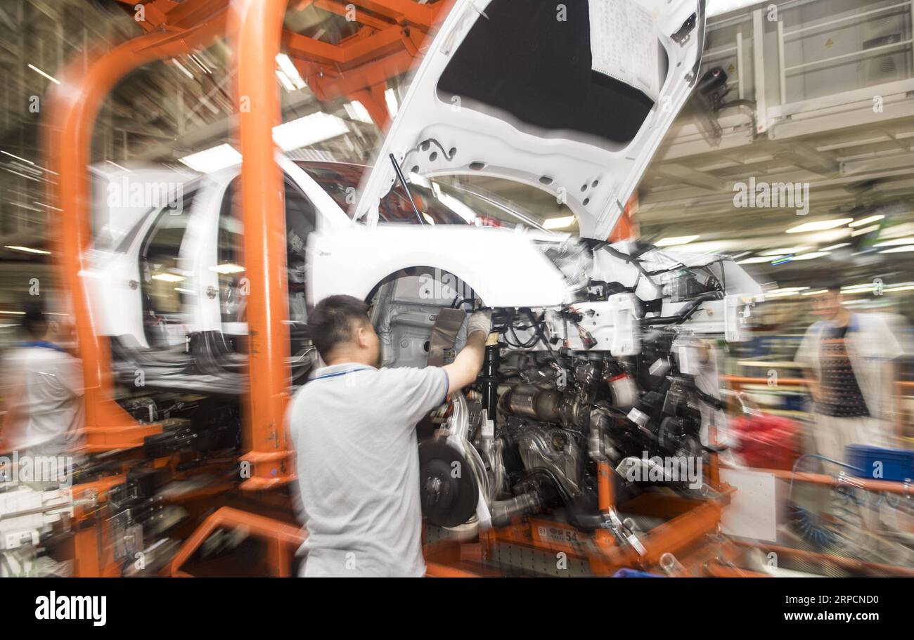 190709 -- CHANGCHUN, July 9, 2019 -- A worker assembles an Audi vehicle at FAW-Volkswagen factory in Changchun, northeast China s Jilin Province, July 9, 2019. The Sino-German auto joint venture FAW-Volkswagen said a record 311,871 Audi vehicles were sold in China in the first half of 2019, up 2.1 percent year-on-year.  CHINA-JILIN-CHANGCHUN-AUDI-SALES RECORD XuxChang PUBLICATIONxNOTxINxCHN Stock Photo