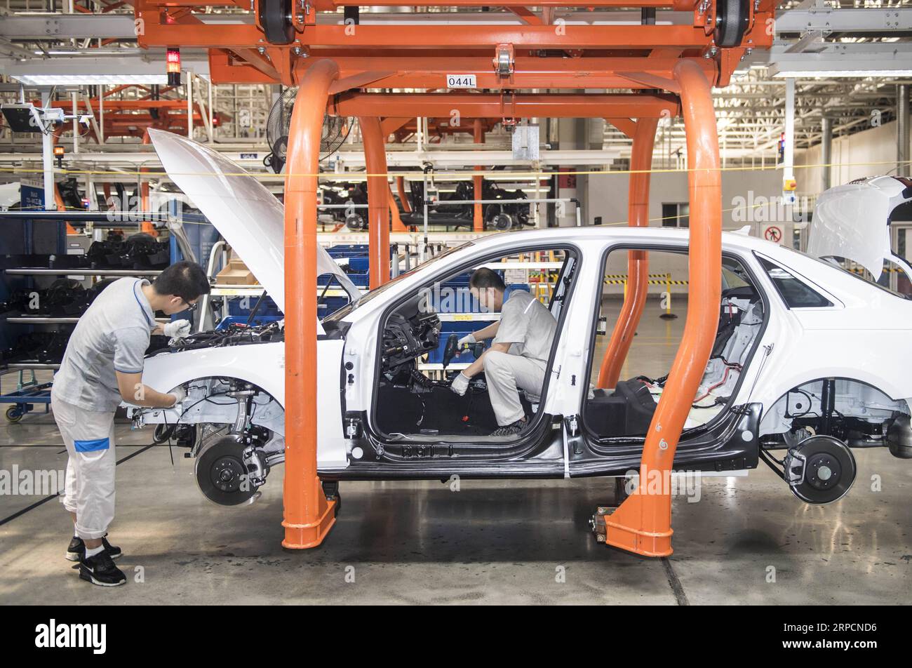 (190709) -- CHANGCHUN, July 9, 2019 -- Workers assembles an Audi car at FAW-Volkswagen factory in Changchun, northeast China s Jilin Province, July 9, 2019. The Sino-German auto joint venture FAW-Volkswagen said a record 311,871 Audi vehicles were sold in China in the first half of 2019, up 2.1 percent year-on-year. ) CHINA-JILIN-CHANGCHUN-AUDI-SALES RECORD XuxChang PUBLICATIONxNOTxINxCHN Stock Photo