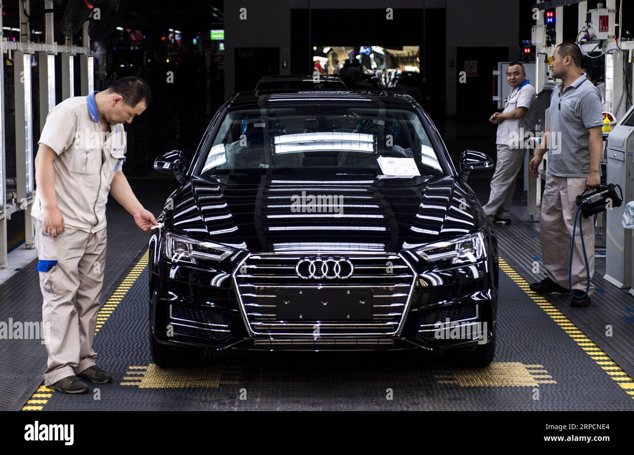 (190709) -- CHANGCHUN, July 9, 2019 -- Workers check an Audi car at FAW-Volkswagen factory in Changchun, northeast China s Jilin Province, July 9, 2019. The Sino-German auto joint venture FAW-Volkswagen said a record 311,871 Audi vehicles were sold in China in the first half of 2019, up 2.1 percent year-on-year. ) CHINA-JILIN-CHANGCHUN-AUDI-SALES RECORD XuxChang PUBLICATIONxNOTxINxCHN Stock Photo