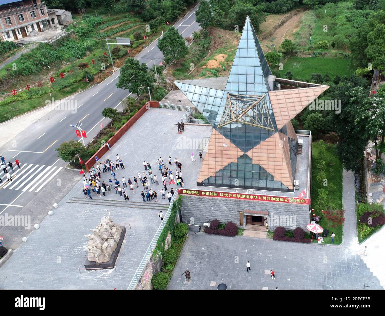 (190710) -- XING AN, July 10, 2019 -- Aerial photo taken on June 28, 2019 shows the memorial hall that commemorates the battle of Xinxu in Guanyang County, south China s Guangxi Zhuang Autonomous Region. The Battle of Xinxu was one of the three major block battles fought in Guangxi, which had brought time for the Red Army to cross the Xiangjiang River. Memorial halls and martyrs cemeteries are springing up in many revolutionary places over the past few years, especially those along the Long March route. Visitors from all over China come to these memorials, reconnecting with history, reclaiming Stock Photo