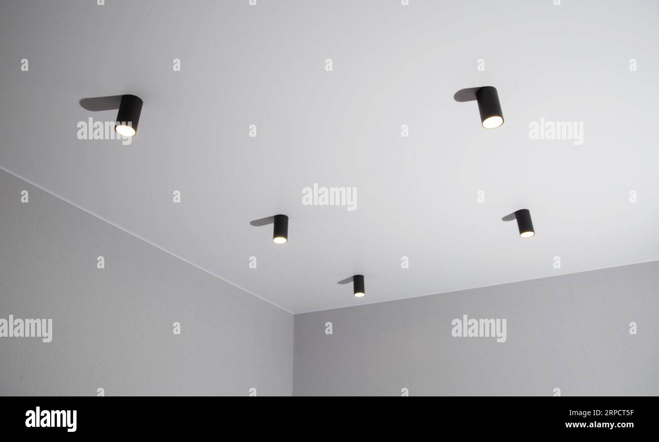 Modern black LED ceiling lights in a room on the ceiling Stock Photo