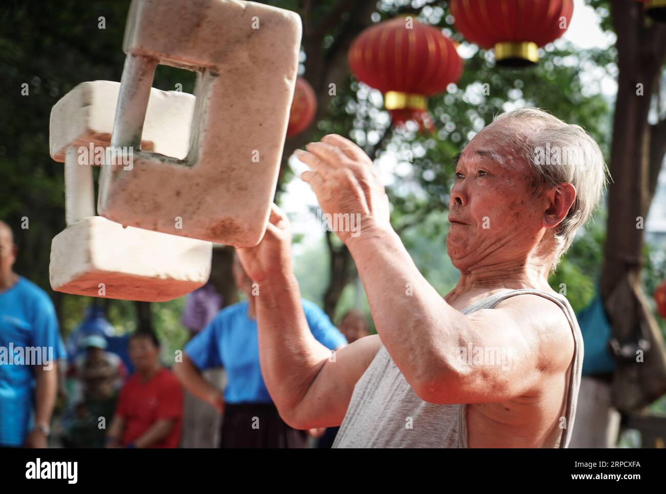 (190715) -- NANJING, July 15, 2019 -- Liu Liangjin, 75, practices Shisuo skills at Yinxiang in Nanjing, east China s Jiangsu Province, June 5, 2019. Shisuo (stone lock), a stone dumbbell in the form of ancient padlock, is usually seen in the traditional Chinese workout routine. With hundreds of workout moves, Shisuo exercise can not only enhance strength, but also help people to coordinate hands, eyes and the body. Shisuo dates back to the Tang Dynasty in which soldiers first used it to build their bodies. The Shisuo exercise has a long history in Nanjing, east China s Jiangsu Province. Endear Stock Photo