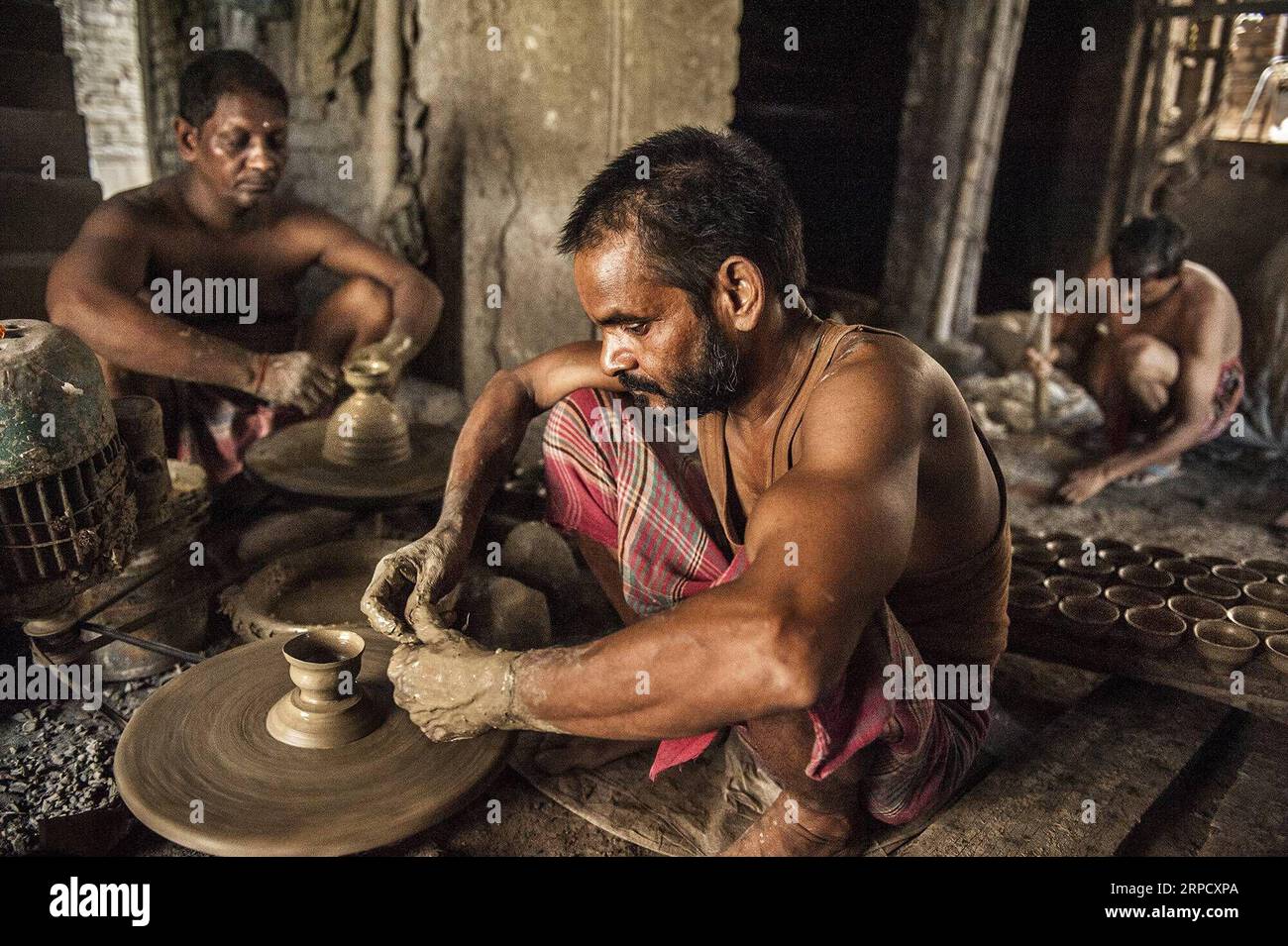 (190715) -- KOLKATA, July 15, 2019 -- Potters make earthenware cups ...