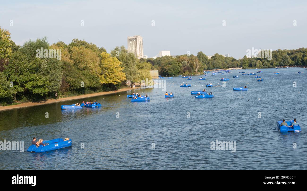 Pedalos on the Serpentine in London's Hyde Park with the Park Lane