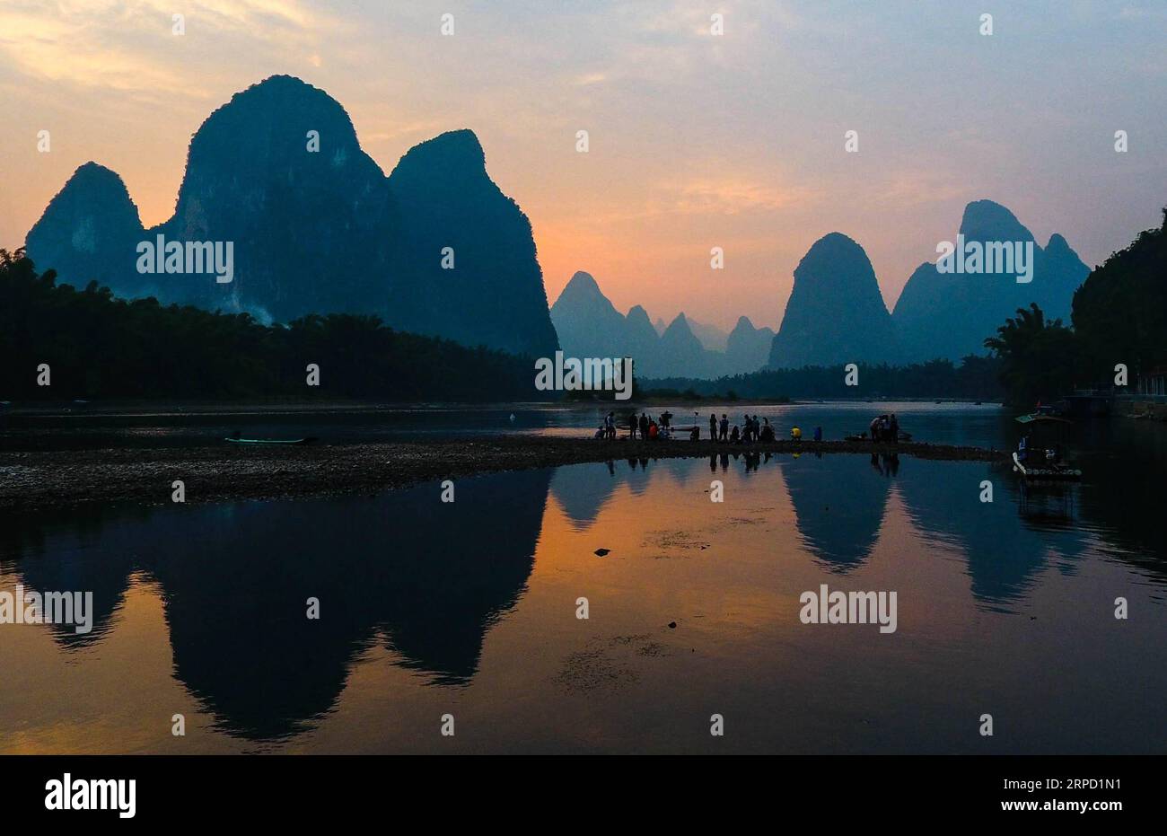 (190719) -- BEIJING, July 19, 2019 -- Aerial photo taken on Oct. 25, 2017 shows the view of Lijiang River in Guilin City, south China s Guangxi Zhuang Autonomous Region. Located in south China, Guangxi boasts high forest coverage of over 62 percent and various landforms including its picturesque karst mountains. In recent years, following the principle of building ecological civilization, Guangxi authorities uphold green development in agricultural production and poverty alleviation. Meanwhile, the authorities take various measures to improve rural environment including expanding forest covera Stock Photo