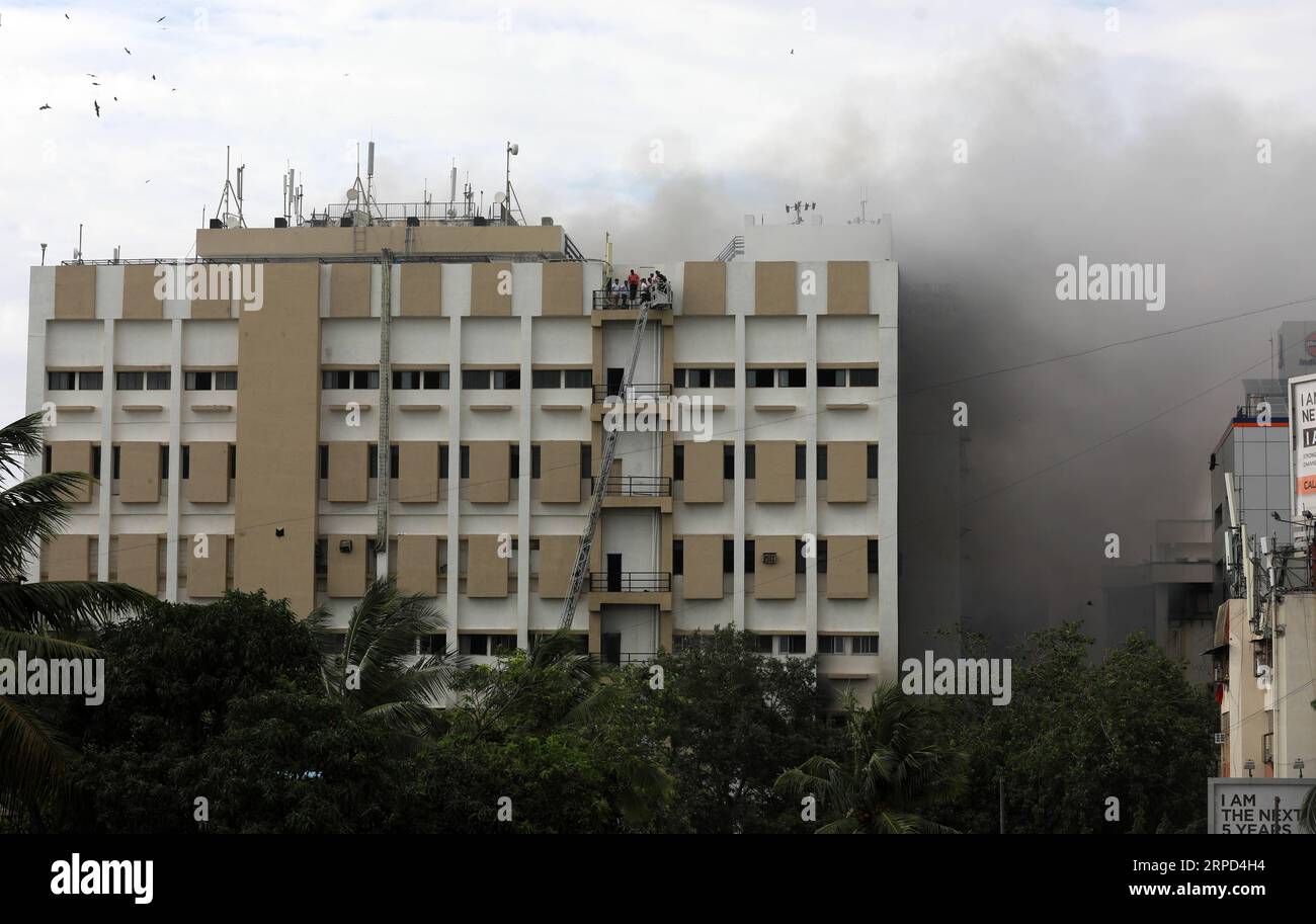 (190723) -- MUMBAI, July 23, 2019 -- Indian firefighters rescue people from Mahanagar Telephone Nigam Limited (MTNL) building after a fire broke out in Mumbai, India, July 22, 2019. (Str/Xinhua) INDIA-MUMBAI-FIRE XinxHuashe PUBLICATIONxNOTxINxCHN Stock Photo