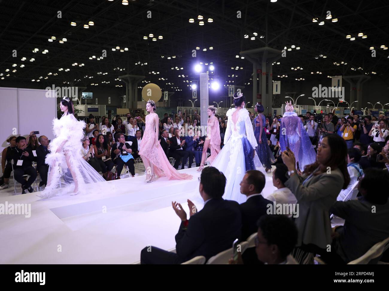 (190722) -- NEW YORK, July 22, 2019 -- Models present creations of a Chinese company during the 20th China Textile and Apparel Trade Show in New York, the United States, July 22, 2019. The 20th China Textile and Apparel Trade Show in New York opened on Monday in Manhattan s Javits Center, serving as a platform to showcase the latest industrial trends and help Chinese companies explore the U.S. market. Over 500 Chinese garment, fabric and textile companies are attending this year s trade show, which will run through Wednesday. Another 300 or so companies from 16 countries and regions also joine Stock Photo