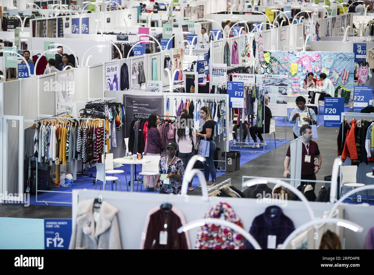 (190722) -- NEW YORK, July 22, 2019 -- People visit the 20th China Textile and Apparel Trade Show in New York, the United States, July 22, 2019. The 20th China Textile and Apparel Trade Show in New York opened on Monday in Manhattan s Javits Center, serving as a platform to showcase the latest industrial trends and help Chinese companies explore the U.S. market. Over 500 Chinese garment, fabric and textile companies are attending this year s trade show, which will run through Wednesday. Another 300 or so companies from 16 countries and regions also joined the show with an exhibition area of 30 Stock Photo