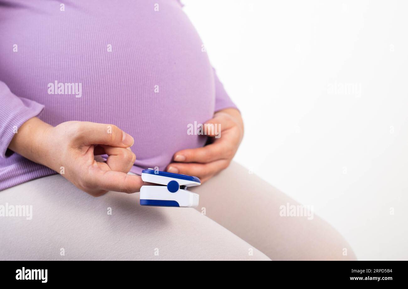 Measurement of oxygen in the blood of a pregnant woman. Hypoxia during pregnancy Stock Photo Alamy