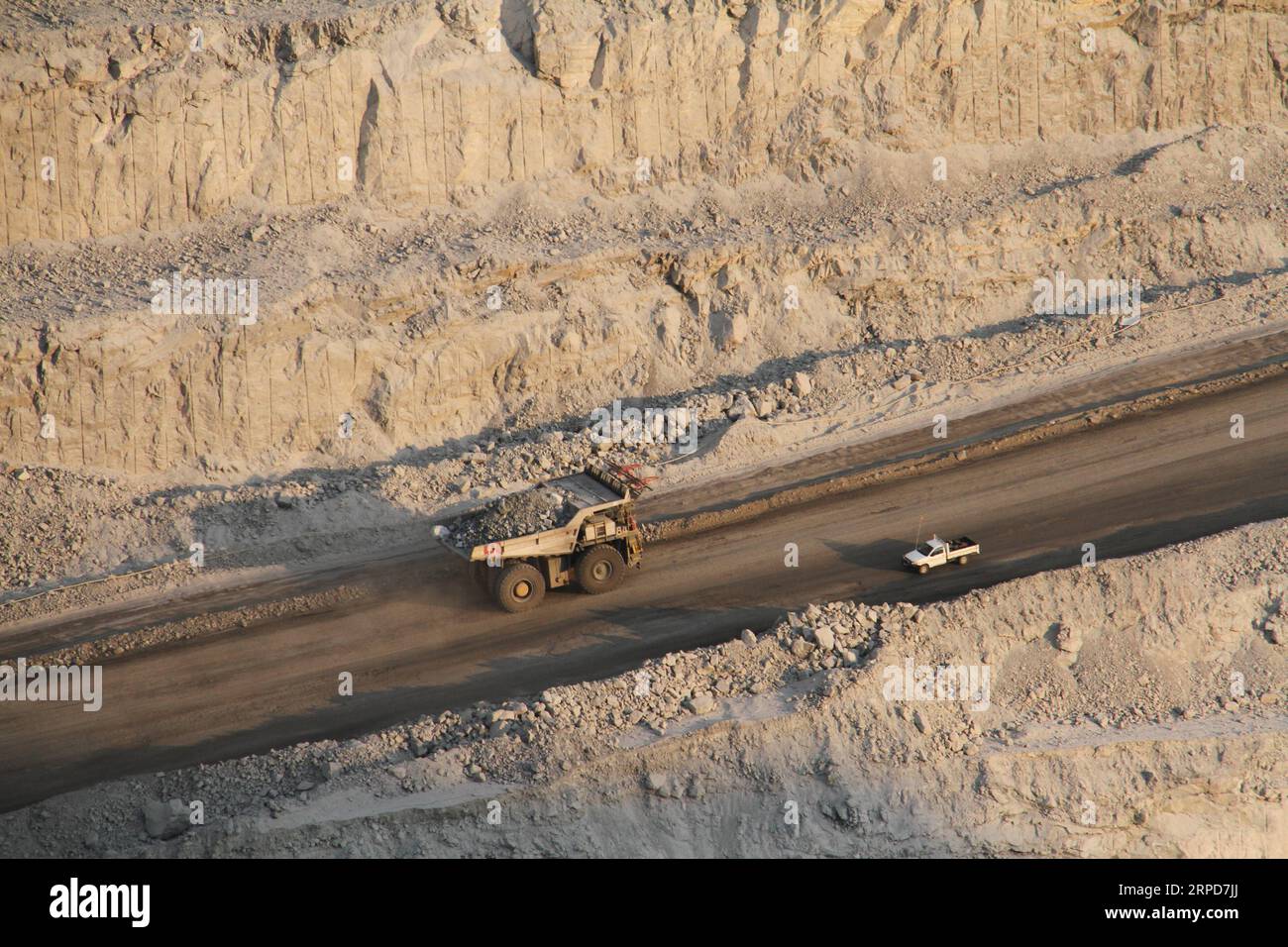 (190725) -- SWAKOPMUND (NAMIBIA), July 25, 2019 -- A truck drives in the pit of Rossing Mine near the town of Swakopmund, Namibia, on July 25, 2019. The Anglo-Australian mining giant Rio Tinto officially handed over Namibian uranium mine Rossing to its new majority shareholder, China National Nuclear Corporation (CNNC) at an event Thursday in Rossing Mine near the coastal town of Swakopmund. ) NAMIBIA-SWAKOPMUND-ROSSING URANIUM MINE-CHINA-HANDOVER WuxChangwei PUBLICATIONxNOTxINxCHN Stock Photo