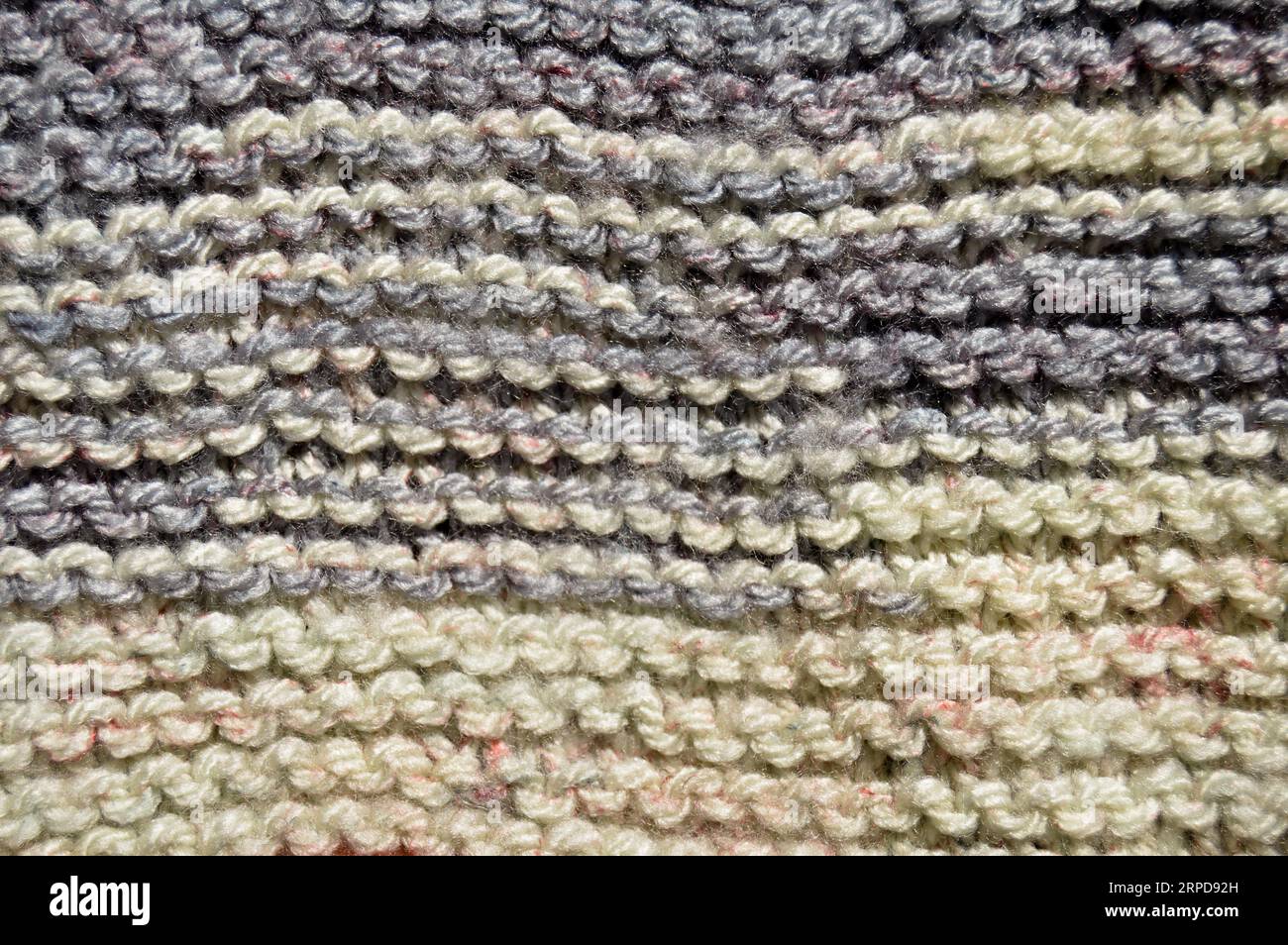 Pattern fabric made of wool. Handmade knitted fabric grey wool ...