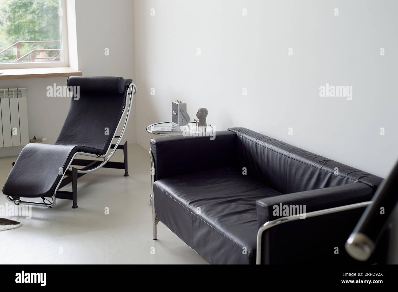 Psychoanalyst's office. Black and white minimalism. Sofa and couch