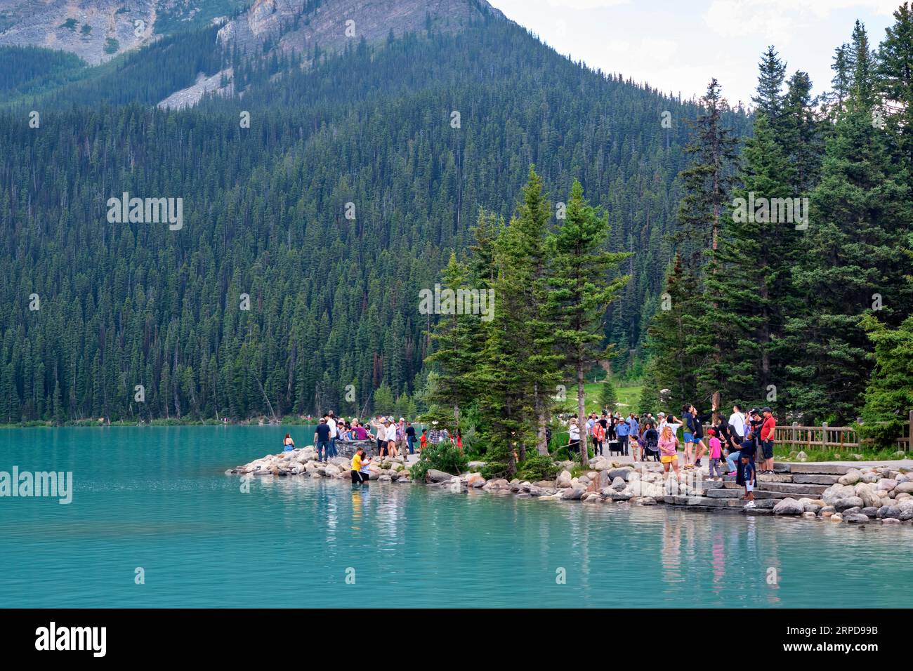 Tourists enjoying the sights at beautiful Lake Louise Alberta. Stock Photo