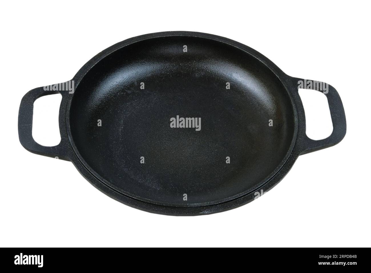 Cast iron pan. Kitchenware isolated on white background. Stock Photo