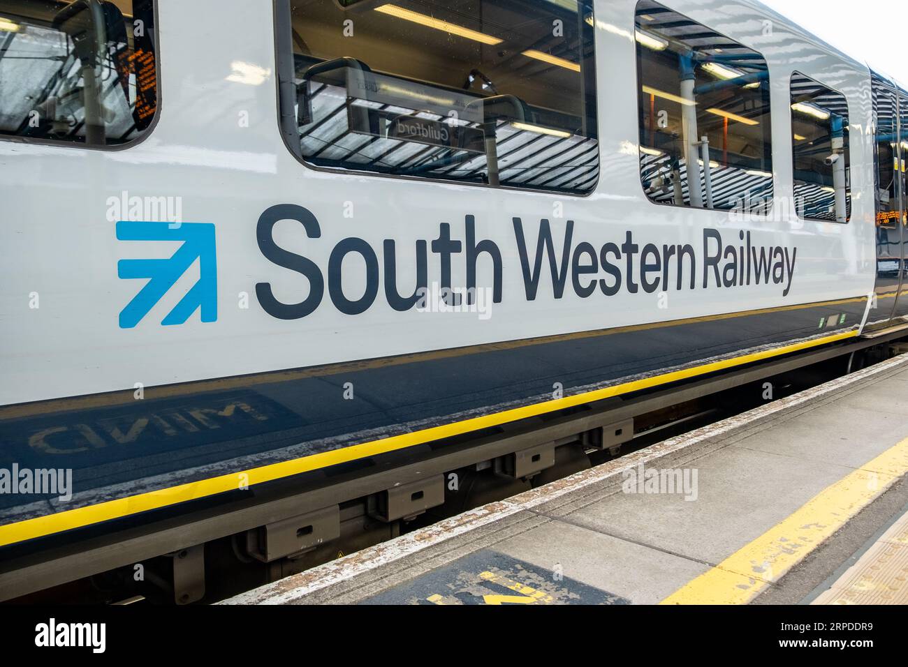 GUILDFORD, SURREY, UK- AUGUST 31, 2023: South Western Railway train on platform at Guildford Station- Surrey train station on the Portsmouth Direct Li Stock Photo