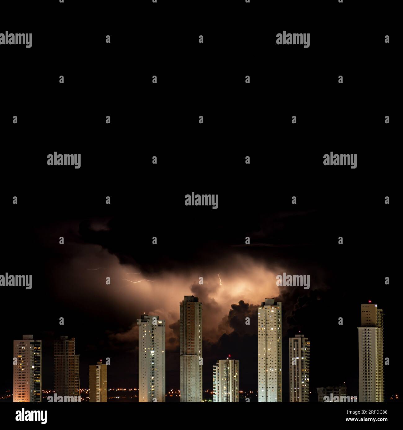Dark Stormy Night Skyline with Illuminated Skyscrapers and Lightning ...