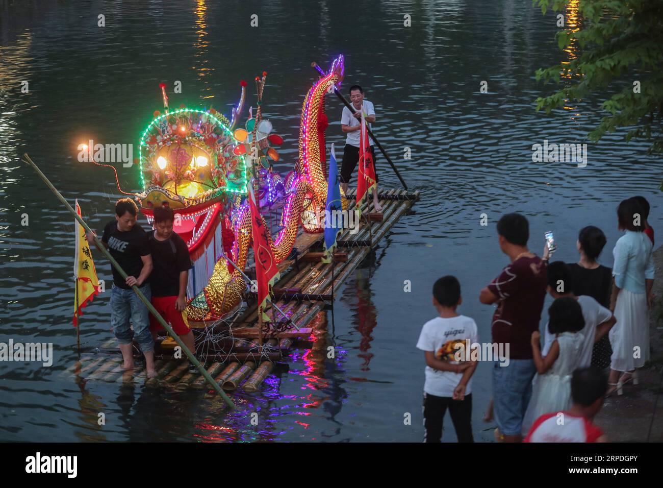(190804) -- HANGZHOU, Aug. 4, 2019 -- People enjoy dragon lantern during the coolness party in Changlyu Town, Hangzhou City of east China s Zhejiang Province, Aug. 3, 2019. A coolness party was held here in Changlyu Town on Saturday, during which people could enjoy the coolness in summer through various activities such as evening gala, fruit picking, basketball game and handicrafts making. ) CHINA-ZHEJIANG-HANGZHOU-COOLNESS PARTY (CN) XuxYu PUBLICATIONxNOTxINxCHN Stock Photo