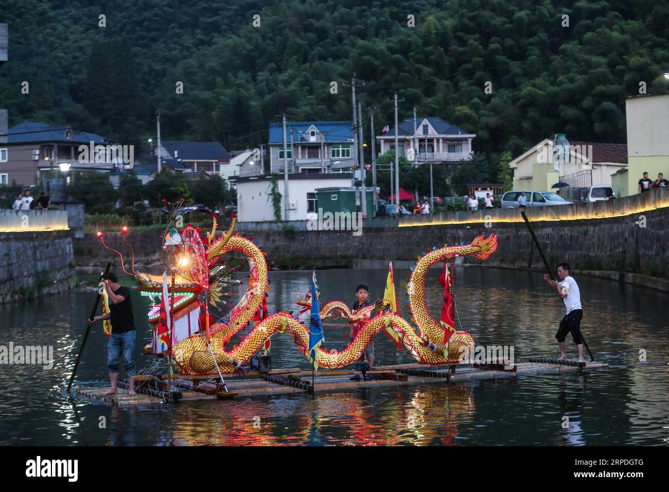 (190804) -- HANGZHOU, Aug. 4, 2019 -- Villagers display dragon lantern during the coolness party in Changlyu Town, Hangzhou City of east China s Zhejiang Province, Aug. 3, 2019. A coolness party was held here in Changlyu Town on Saturday, during which people could enjoy the coolness in summer through various activities such as evening gala, fruit picking, basketball game and handicrafts making. ) CHINA-ZHEJIANG-HANGZHOU-COOLNESS PARTY (CN) XuxYu PUBLICATIONxNOTxINxCHN Stock Photo
