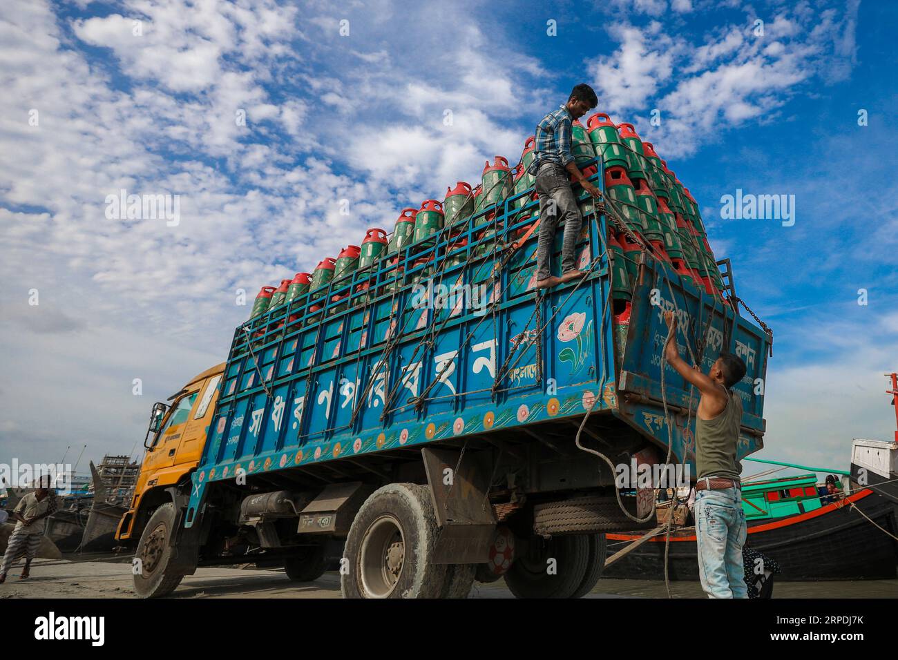 Chittagong, Bangladesh. 22nd July, 2023. A worker arranges LPG gas