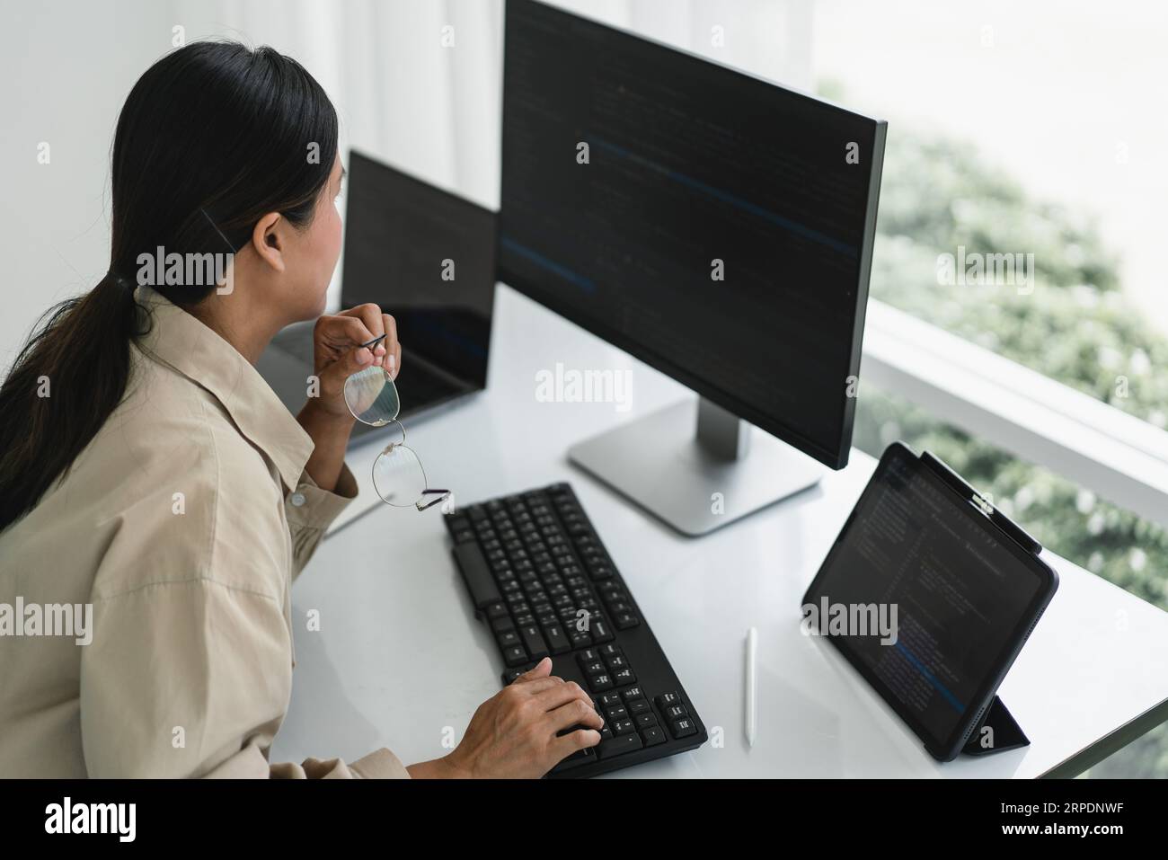 Developer programmer working to checking code on monitor while programming to developing website. Stock Photo