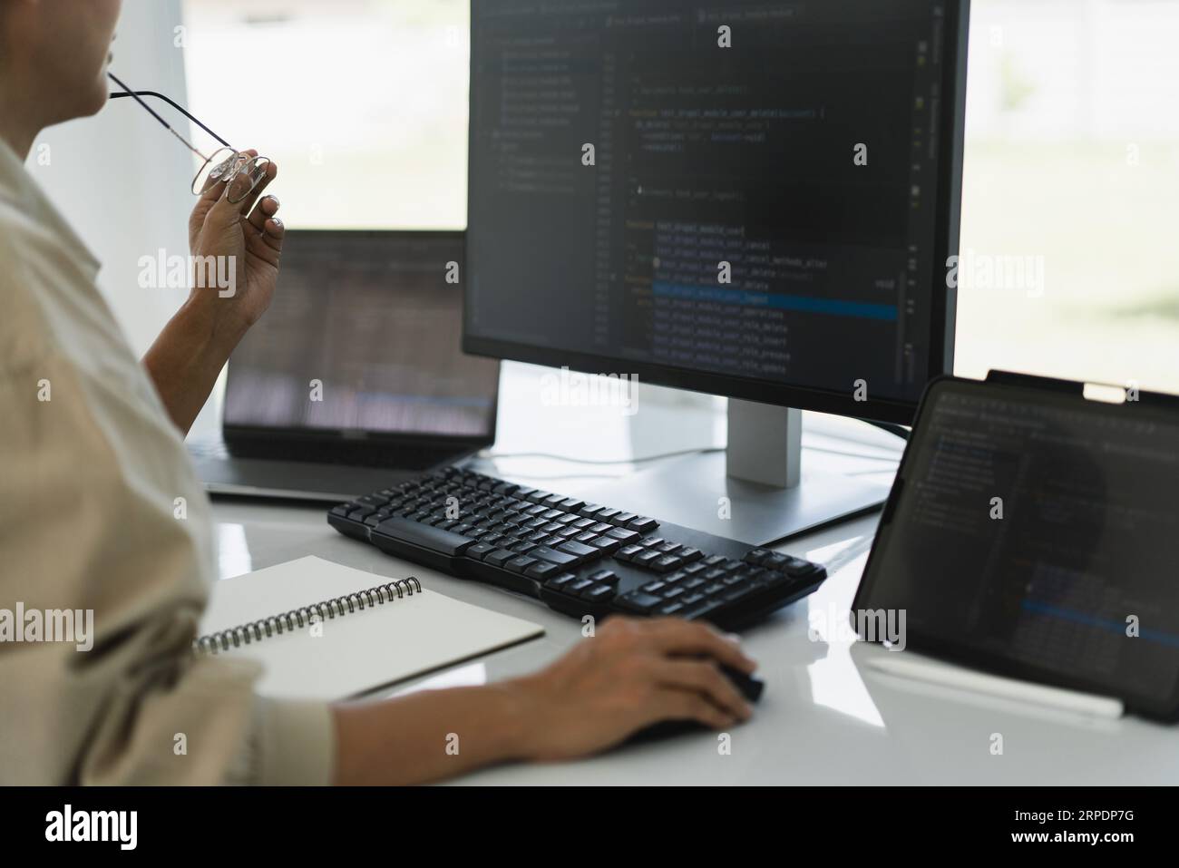Developer programmer working to checking code on monitor while programming to developing website. Stock Photo