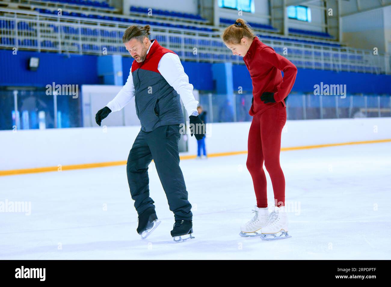 Professional skater, man training girl, learning figure skating