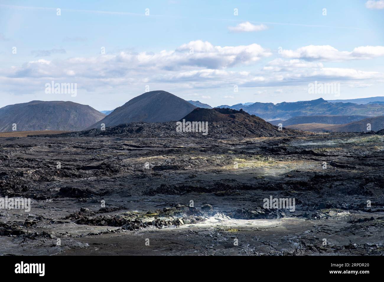 Panoramic view over lavafield near mountain Fagradalsfjall with fissure vent of 2021 in Geldingadalir volcano area to the south of Fagradalsfjall moun Stock Photo