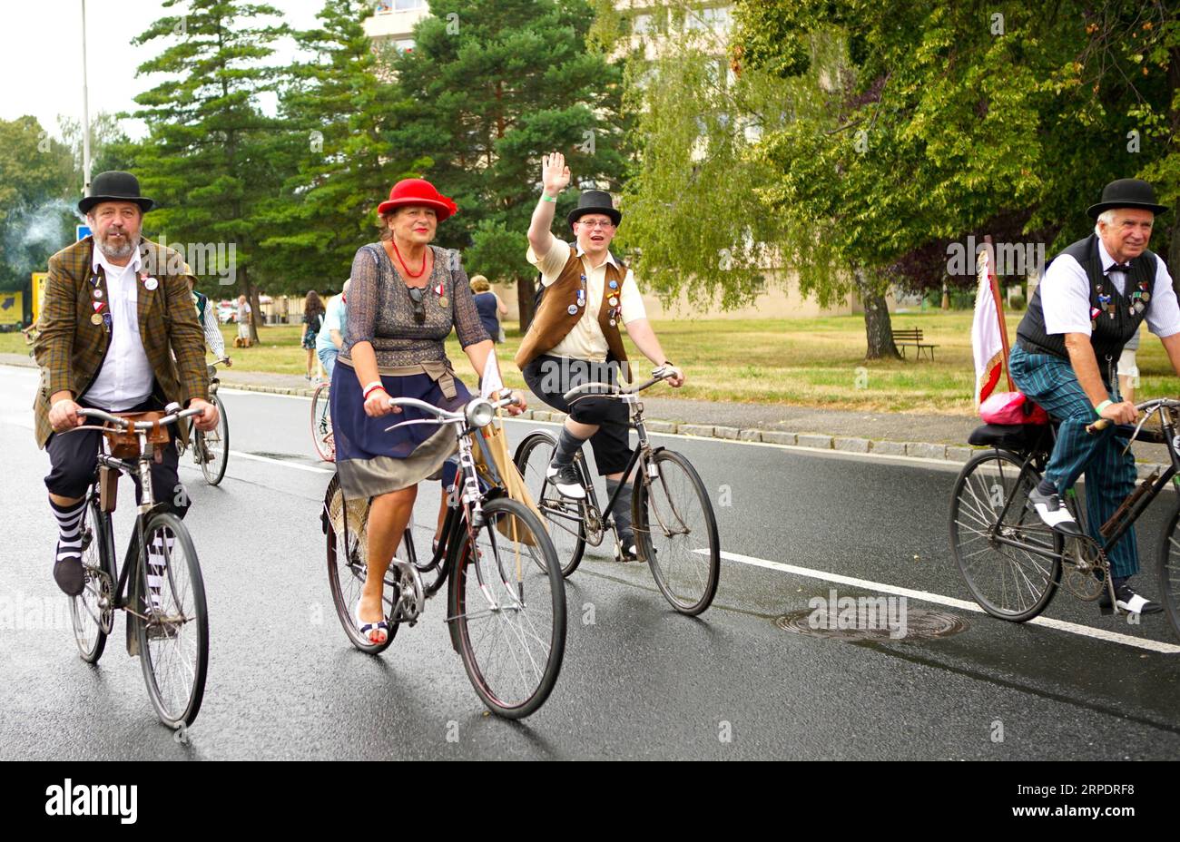 (190810) -- PRAGUE, Aug. 10, 2019 (Xinhua) -- Cyclists take part in a commemorative ride in Kutna Hora, the Czech Republic, Aug. 10, 2019. Dozens of cyclists in traditional clothing rode historical bikes and passed through the central Czech city of Kutna Hora on Saturday afternoon to celebrate the 150th anniversary of the first bike race on the Czech land. The first cycling race in Bohemia was said to be held in Kutna Hora on Aug. 8, 1869 on the road between Kutna Hora and Sedlec. (Photo by Dana Kesnerova/Xinhua) CZECH REPUBLIC-KUTNA HORA-BIKE RACE-COMMEMORATION PUBLICATIONxNOTxINxCHN Stock Photo