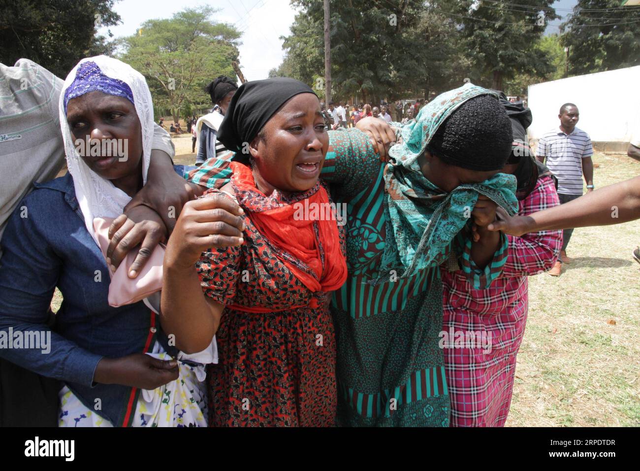 (190811) -- MOROGORO, Aug. 11, 2019 -- Relatives of tanker explosion victims cry in a burial ceremony in Morogoro, Tanzania on Aug. 11, 2019. Tanzanian President John Magufuli has declared three days of national mourning following an oil tanker explosion that killed over 60 people and injured 70 others in Morogoro on Saturday, said a statement released early Sunday. TANZANIA-MOROGORO-TANKER-EXPLOSION-MOURNING Lisibo PUBLICATIONxNOTxINxCHN Stock Photo