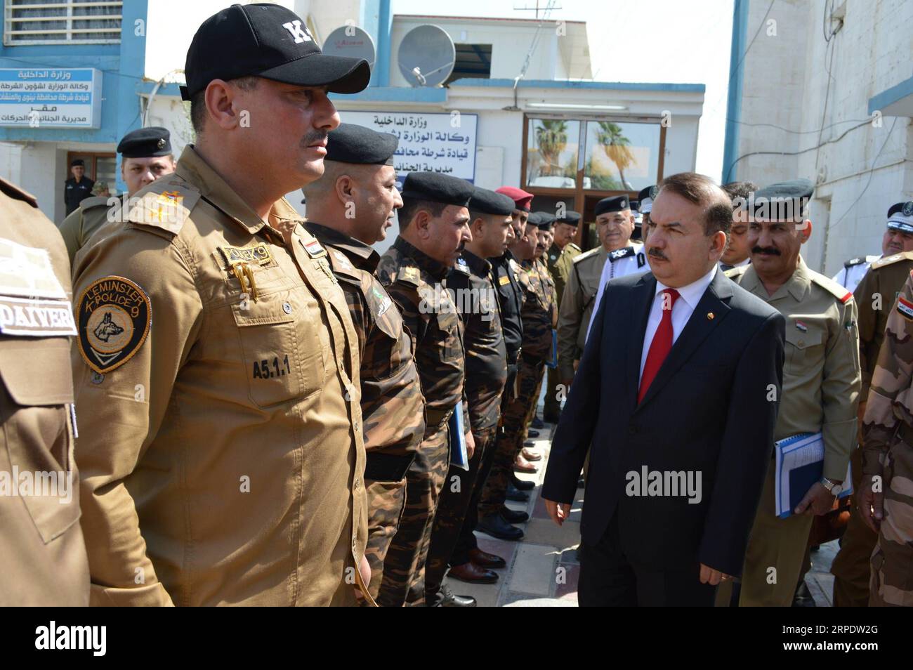 (190812) -- , Aug. 12, 2019 -- Iraqi Interior Minister Yassin al-Yasiri inspects police officers in Mosul, Iraq on Aug. 11, 2019. The Iraqi Interior Ministry reinstated more than 13,000 police personnel after being fired following the extremist Islamic State (IS) militants took control of Iraq s northern city of Mosul in 2014. IRAQ--POLICE PERSONNEL REINSTATING Baghdad PUBLICATIONxNOTxINxCHN Stock Photo