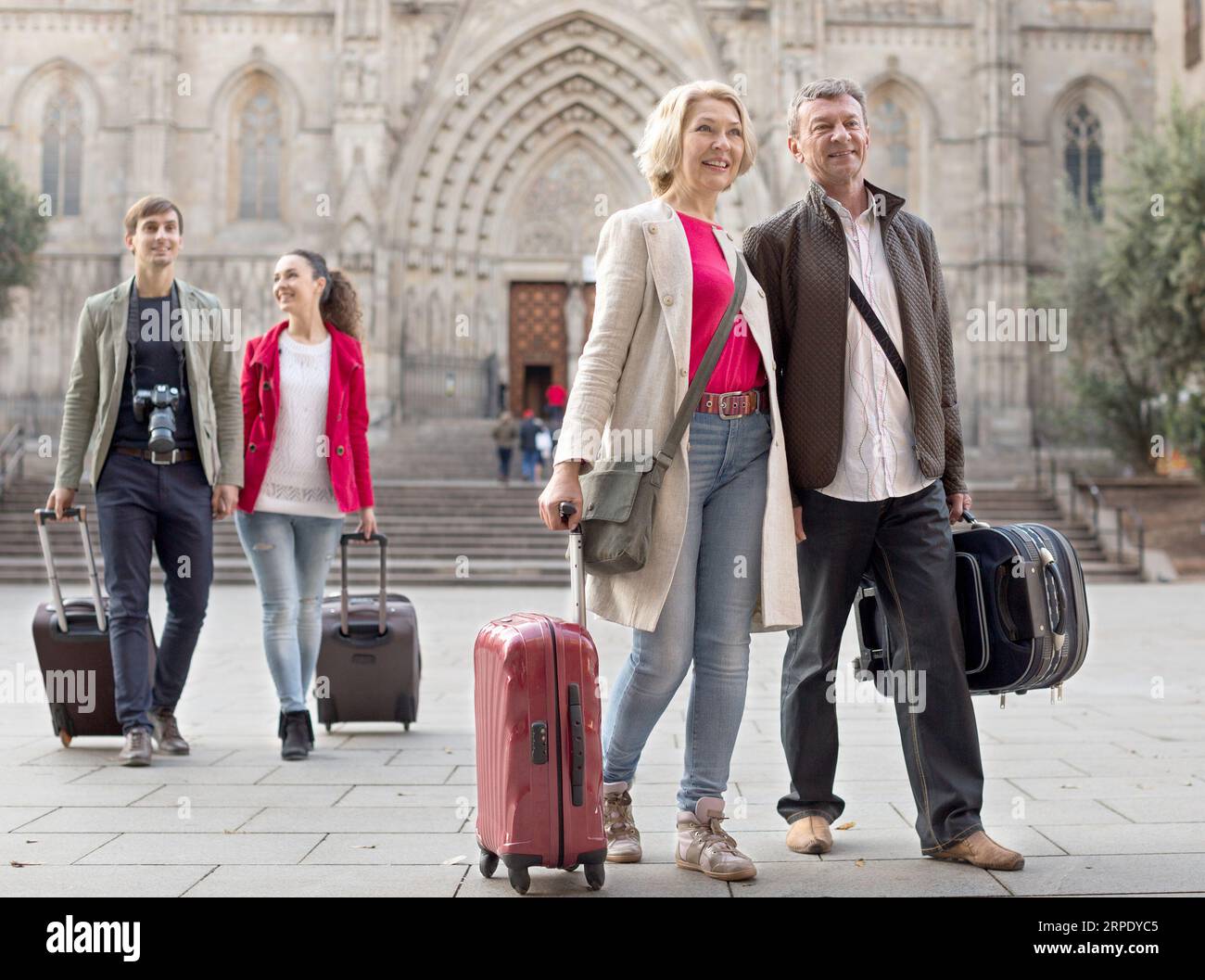 Tourists With Suitcases And Camera Walk In Barcelona Stock Photo Alamy Tourists With Suitcases And Camera Walk In Barcelona Stock Photo Alamy
