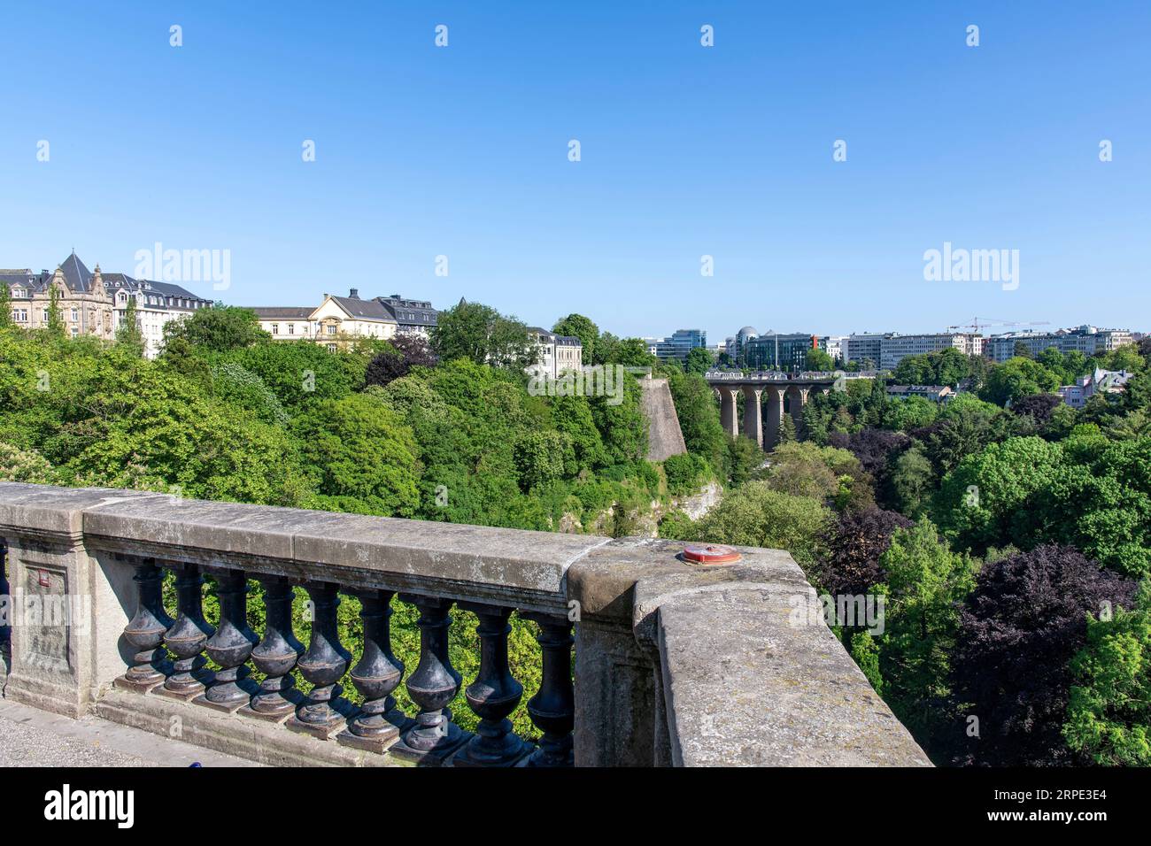 Ville-Haute Luxembourg-May 25, 2023; Stone fence on fortified walls around the city with below the Pétrusse Parks Stock Photo