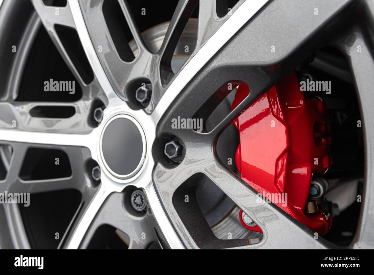 Red Brake calipers on a car with rims close up Stock Photo Alamy
