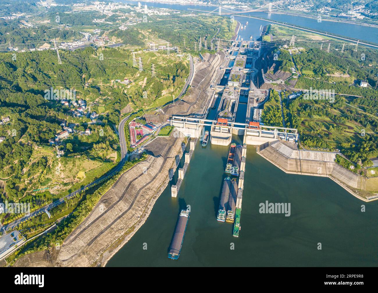 Zigui. 4th Sep, 2023. This aerial photo taken on Sept. 4, 2023 shows ships passing through the five-tier ship locks of the Three Gorges Dam in Yichang, central China's Hubei Province. The monthly cargo throughput via the five-tier ship locks at the Three Gorges Dam, the world's largest hydropower project in the upper stream of the Yangtze, reached a record high of over 15.71 million tonnes in August, according to the China Three Gorges Corporation. Credit: Zheng Jiayu/Xinhua/Alamy Live News Stock Photo