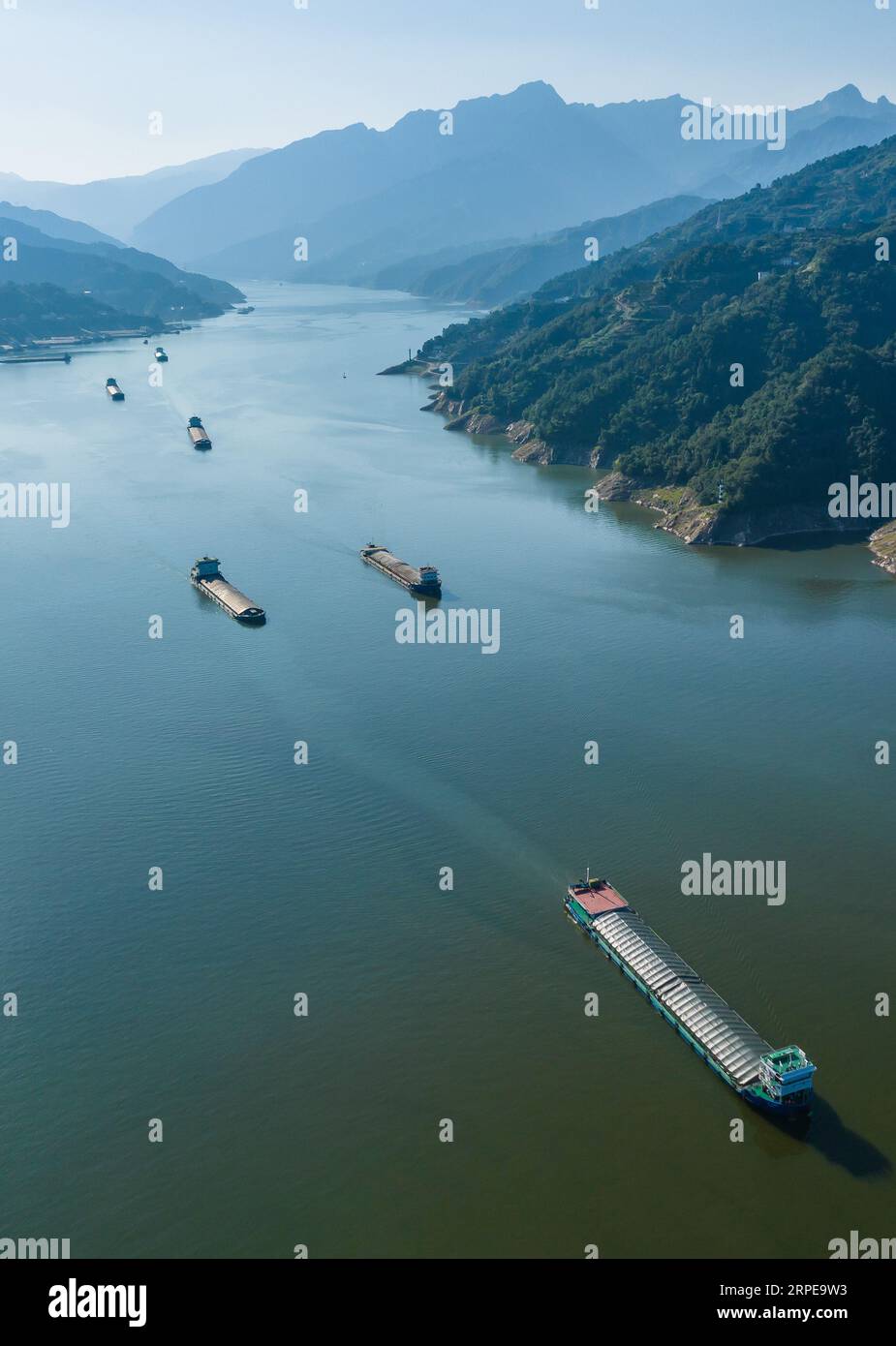 Zigui. 4th Sep, 2023. This aerial photo taken on Sept. 4, 2023 shows ships sailing at the Zigui Harbor in Zigui County of Yichang, central China's Hubei Province. The monthly cargo throughput via the five-tier ship locks at the Three Gorges Dam, the world's largest hydropower project in the upper stream of the Yangtze, reached a record high of over 15.71 million tonnes in August, according to the China Three Gorges Corporation. Credit: Zheng Jiayu/Xinhua/Alamy Live News Stock Photo